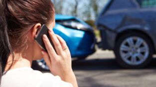 28154953 - female driver making phone call after traffic accident